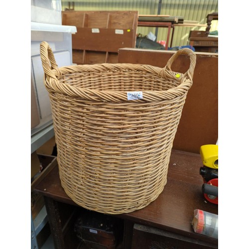 386 - Large wicker log basket. H43cm