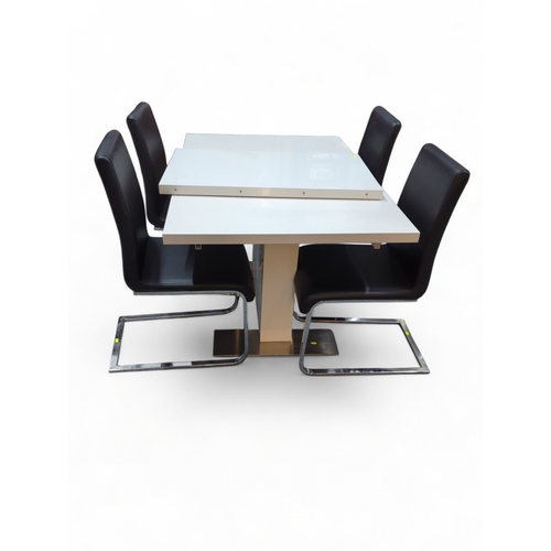 832 - Morden white and chrome extendable table with 4 black chairs. 130cm x 90cm