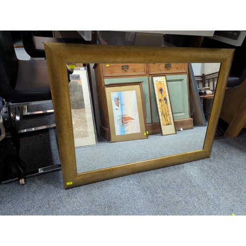 834 - Gilt framed rectangular wall mirror, 89 x 63cm