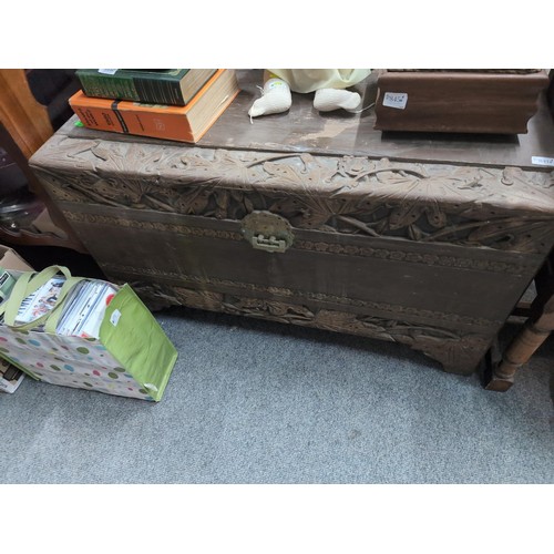 841 - South East Asian camphorwood blanket chest with carved flora and fauna, width 104cm, depth b53cm, he... 