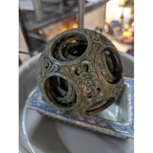 676 - Asian items inc. green stone puzzle ball, pair of Foo dogs etc.