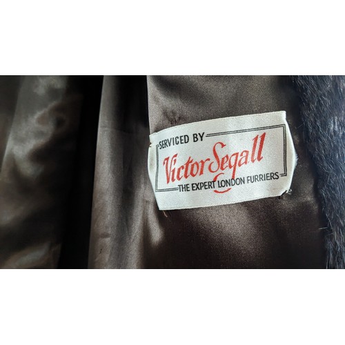 854A - Brown 3/4 length fur coat, possibly mink, labelled Victor Degall. Lining and fur in excellent condit... 