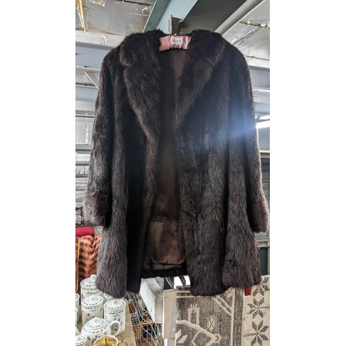 854A - Brown 3/4 length fur coat, possibly mink, labelled Victor Degall. Lining and fur in excellent condit... 