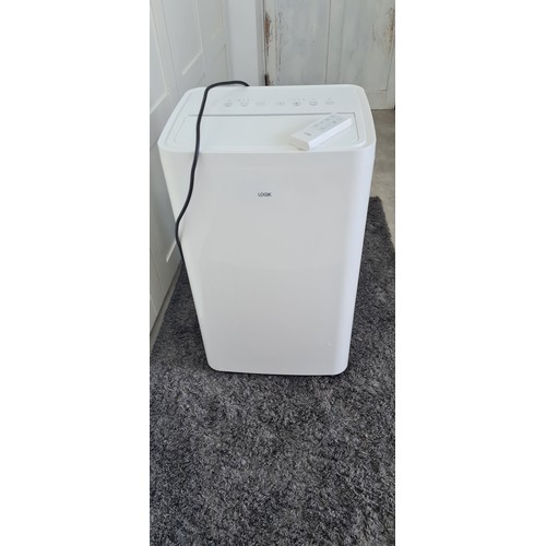 273 - Logik model LAC12C24 aircon + dehumidifier. Vendor confirms full working order with remote and acces... 