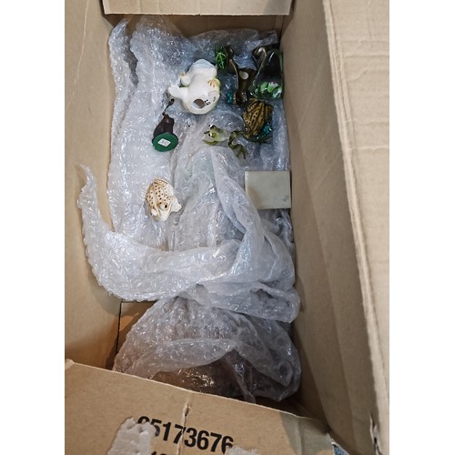 743 - Box of assorted frog ornaments inc. ceramic, brass and wooden as well as two dessicated frogs