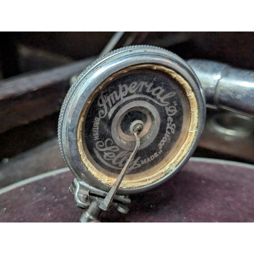 46 - Oak gramophone in cabinet in working order. 70cm by 46cm by 81cm.