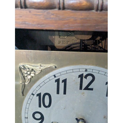 47 - Wall clock. Pendulum and key both present. Marked D.R.P. to rear but unable to see serial number wit... 