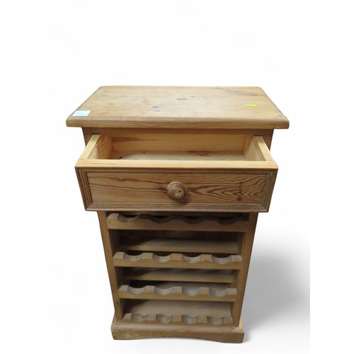 112 - Pine wine rack with top drawer. Holds 16 bottles. W51cm D30cm H90cm.