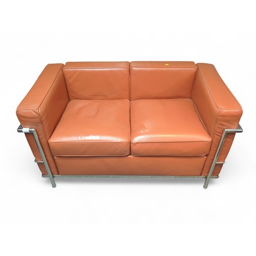 67 - Le Corbusier-style 2-seater sofa in burnt orange. W127cm D72cm H69cm.