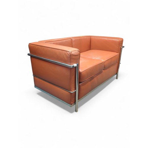 67 - Le Corbusier-style 2-seater sofa in burnt orange. W127cm D72cm H69cm.