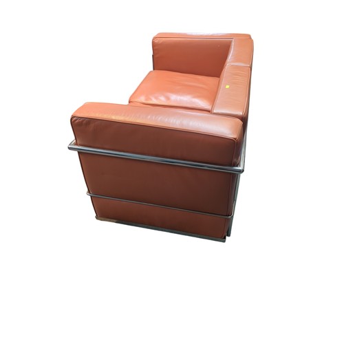 67 - Le Corbusier-style 2-seater sofa in burnt orange. W127cm D72cm H69cm.