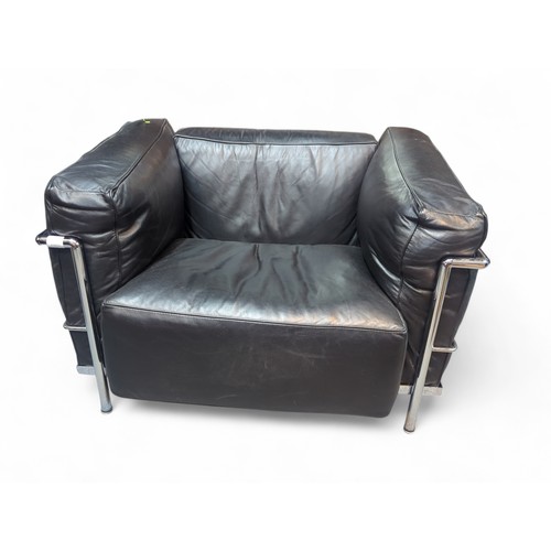 68 - Le Corbusier-style armchair in black leather. W98cm D73cm H64cm.