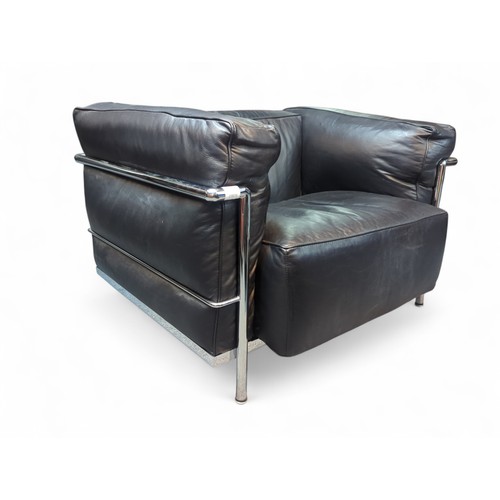 68 - Le Corbusier-style armchair in black leather. W98cm D73cm H64cm.