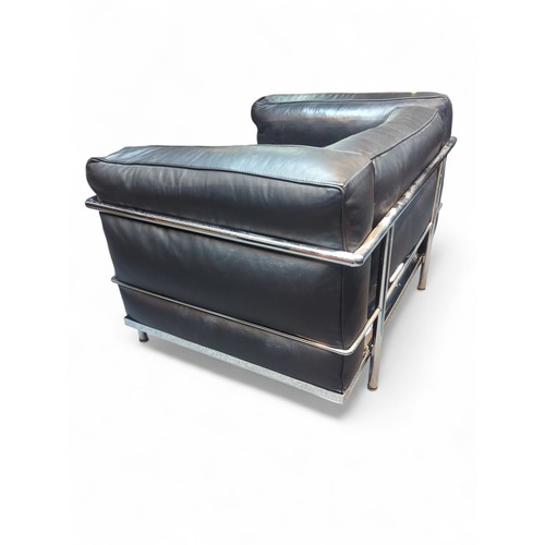 68 - Le Corbusier-style armchair in black leather. W98cm D73cm H64cm.