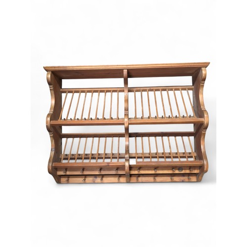 117 - Pitch pine plate penny rack, double width. With inset penny. W96cm D22cm H75cm