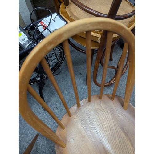 129 - Set of 4 beech and elm Ercol Windsor dining chairs.