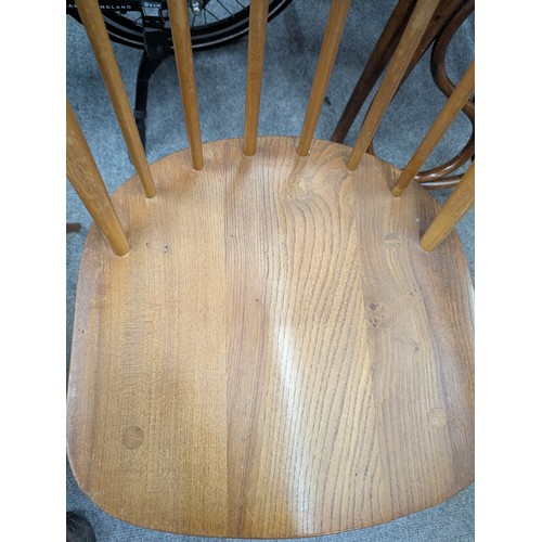 129 - Set of 4 beech and elm Ercol Windsor dining chairs.