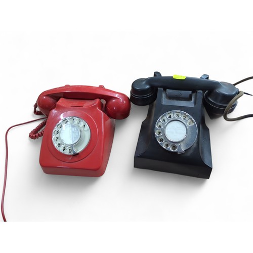 143 - 2 x rotary phones (1 red, 1 black marked A.E.P).