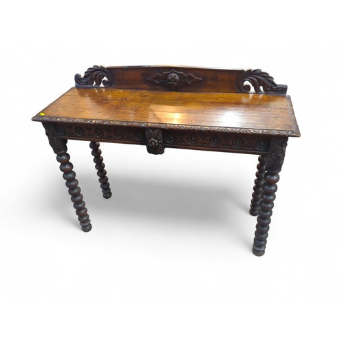 154A - Oak console table with carved detail. W120cm D43cm H95cm.