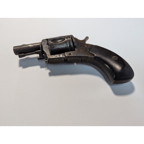 595 - Small five shot revolver, checkering to ebonised handle, bears proof mark, length 12cm