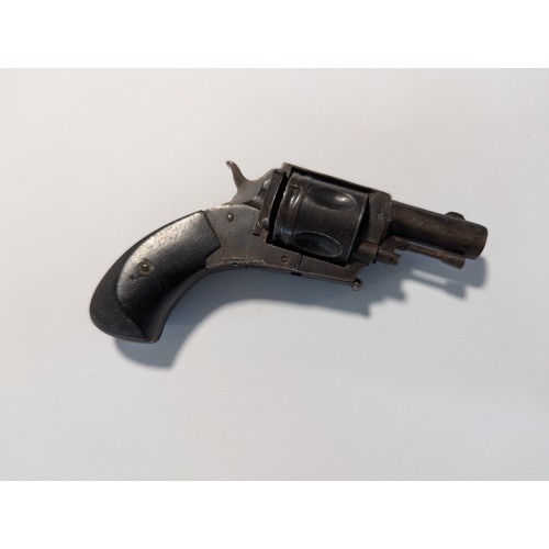 595 - Small five shot revolver, checkering to ebonised handle, bears proof mark, length 12cm