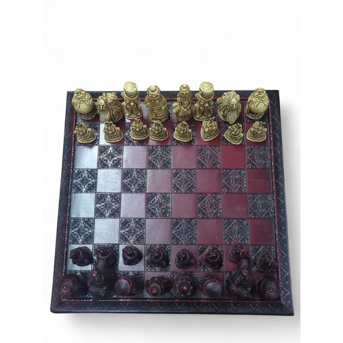 177 - Alice in Wonderland themed chess set, with a complete set of composite figures