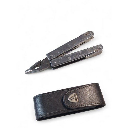 601 - Victorinox Swiss tool multi tool in leather pouch