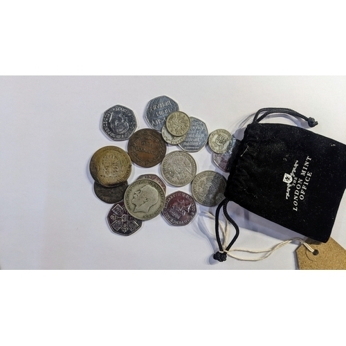 586 - Pouch containing various silver coins and assorted 50 pence coins etc, gross weight 135 grams