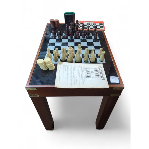 189 - Reversible games table (chess draughts and backgammon) + instructions and pieces. W41cm L61cm H50cm.