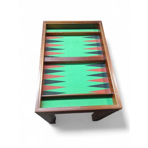 189 - Reversible games table (chess draughts and backgammon) + instructions and pieces. W41cm L61cm H50cm.