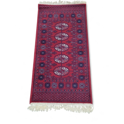 280 - Geometric runner rug in red and blue colours 68cm by 150cm approx