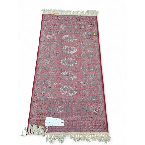 280 - Geometric runner rug in red and blue colours 68cm by 150cm approx