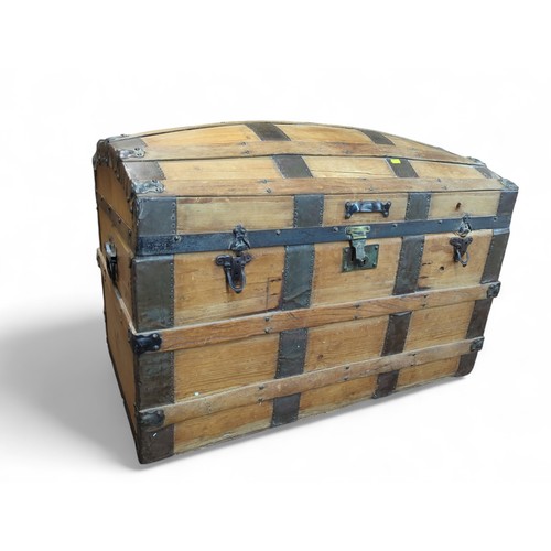 374 - Metal-bound travel chest. W93cm D51cm H63cm.