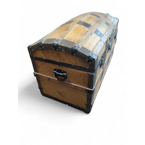 374 - Metal-bound travel chest. W93cm D51cm H63cm.