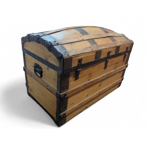 374 - Metal-bound travel chest. W93cm D51cm H63cm.