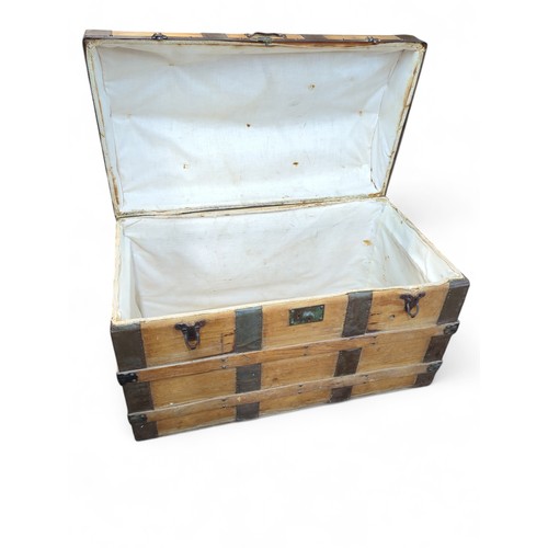 374 - Metal-bound travel chest. W93cm D51cm H63cm.