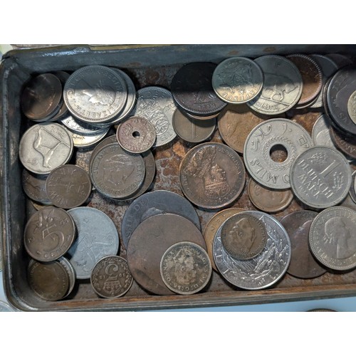 583 - Tin of assorted coins and banknotes, including some silver, gross weight including tin 700 grams