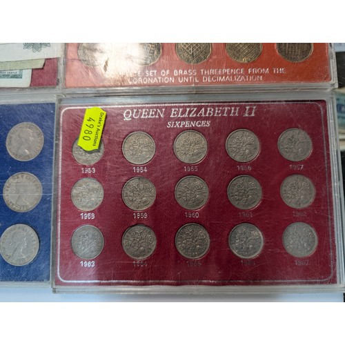 584 - Five Elizabeth II collectors coin sets and some British banknotes