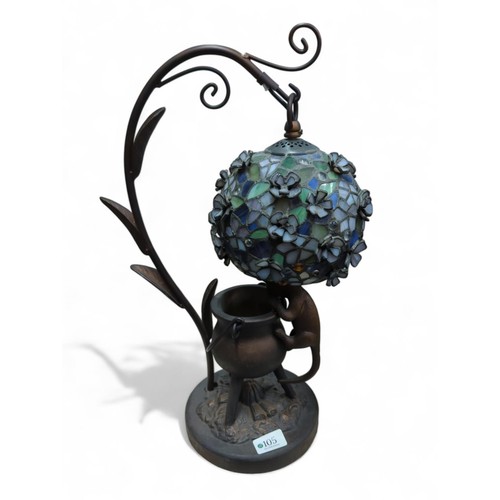 105 - Tiffany-style lamp with cat and cauldron base. Overall height 48cm.