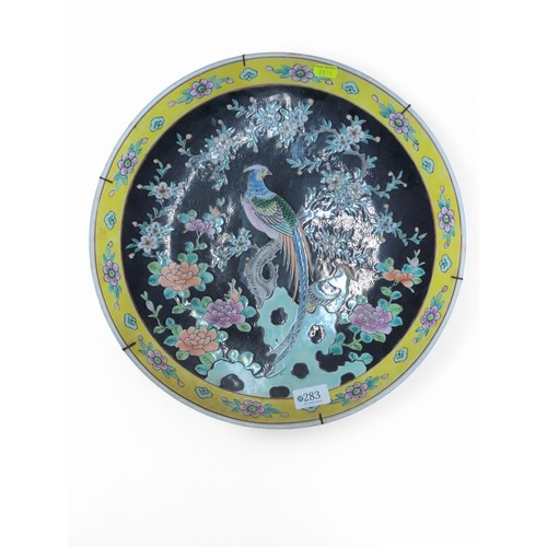 283 - Chinese charger decorated with Asiatic pheasants with flowers on a black ground, unmarked, diameter ... 