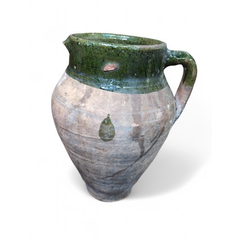 298 - Terracotta jug with green glazed rim and handle, height 336cm