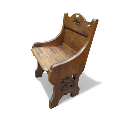 64 - Oak hall chair with carved detail. W52cm D40cm H81cm.