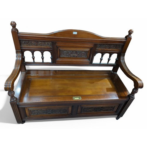 75 - C.19th mahogany storage bench on casters. W122cm D50cm H96cm.