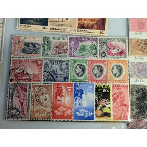 587 - Small quantity of presentation packs and used stamps