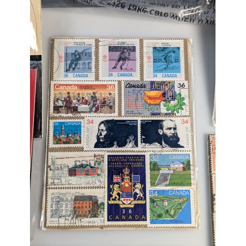 587 - Small quantity of presentation packs and used stamps