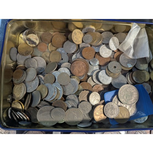 588 - Two tins of British and world coins, gross weight including tins 4.3kg