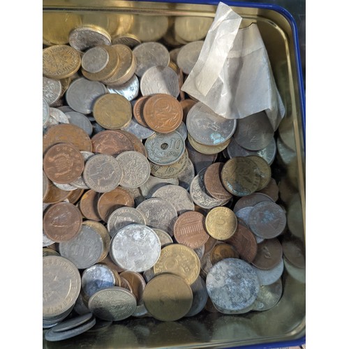 588 - Two tins of British and world coins, gross weight including tins 4.3kg