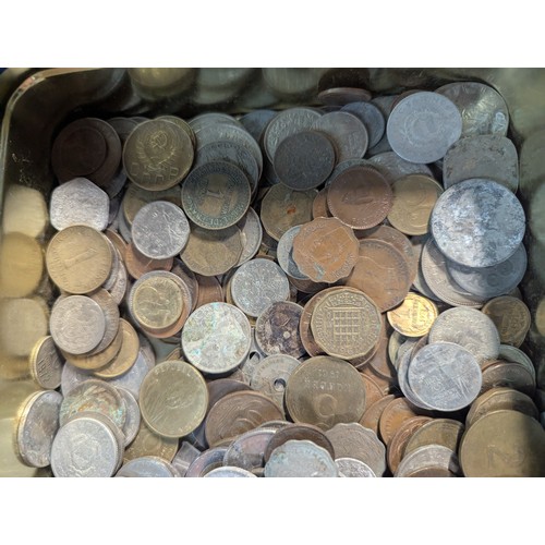 588 - Two tins of British and world coins, gross weight including tins 4.3kg