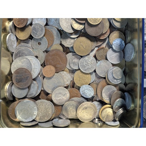 588 - Two tins of British and world coins, gross weight including tins 4.3kg