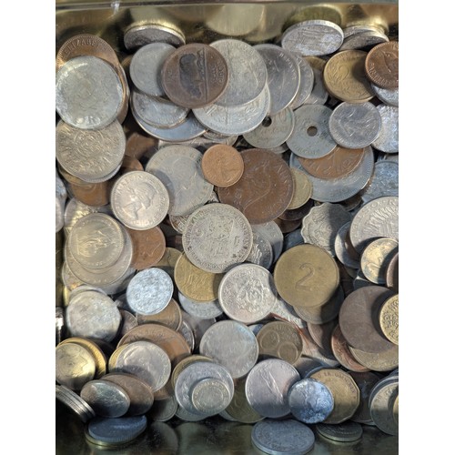 588 - Two tins of British and world coins, gross weight including tins 4.3kg